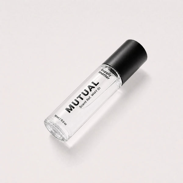 MUTUAL liquid cologne bottle, angled side view