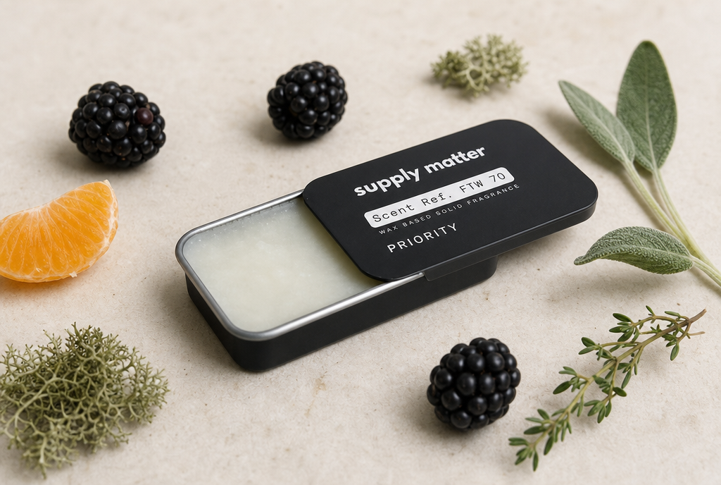 PRIORITY solid cologne tin, half open, with blackberries, mandarin, sage and oakmoss
