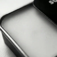 Close-up of the smooth wax in a solid cologne tin