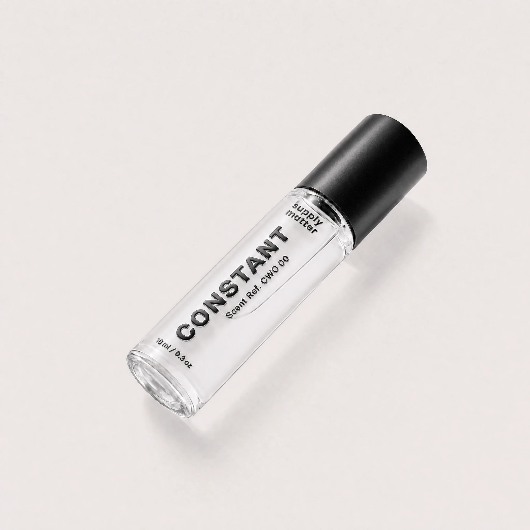 CONSTANT liquid cologne bottle, angled side view