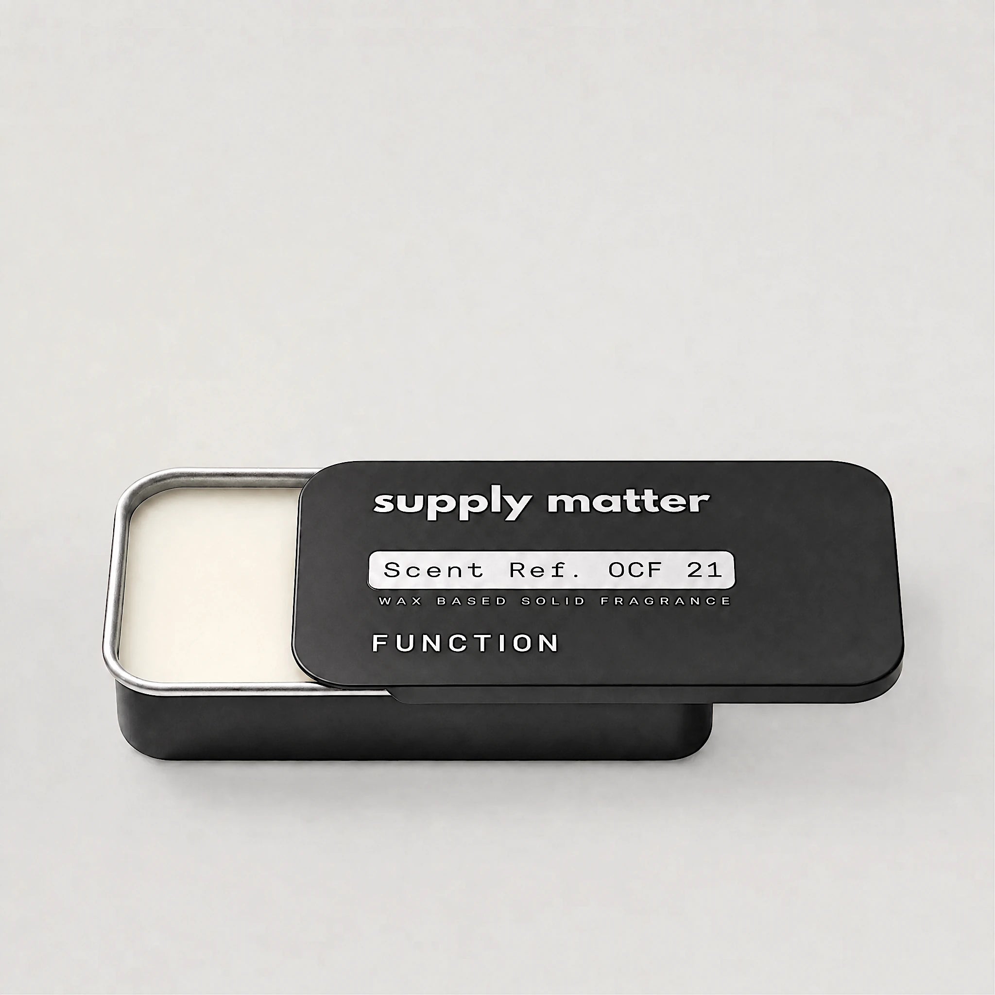FUNCTION solid cologne tin, angled side view