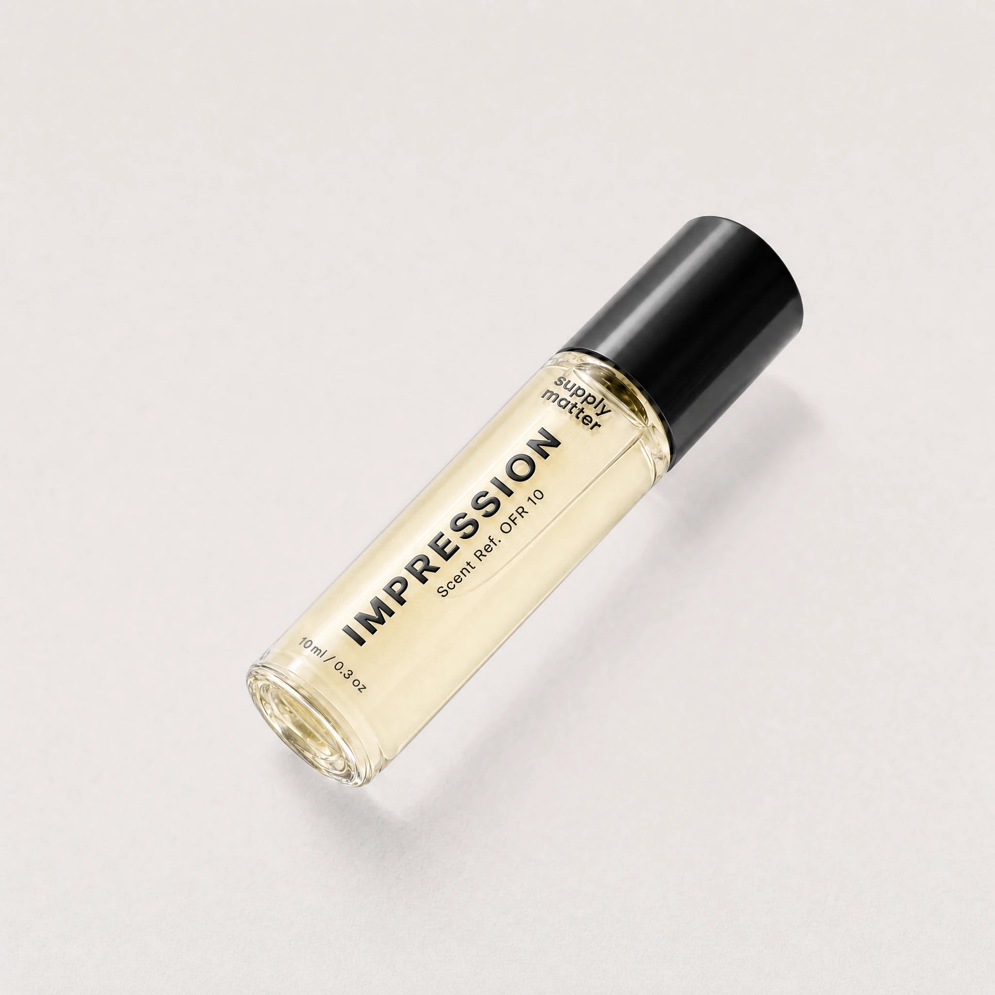 IMPRESSION liquid cologne bottle, angled side view