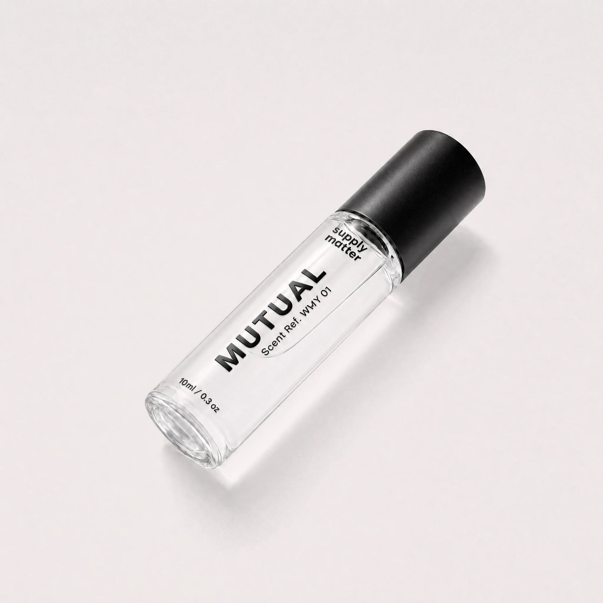 MUTUAL liquid cologne bottle, angled side view