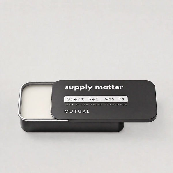 MUTUAL solid cologne tin, angled side view