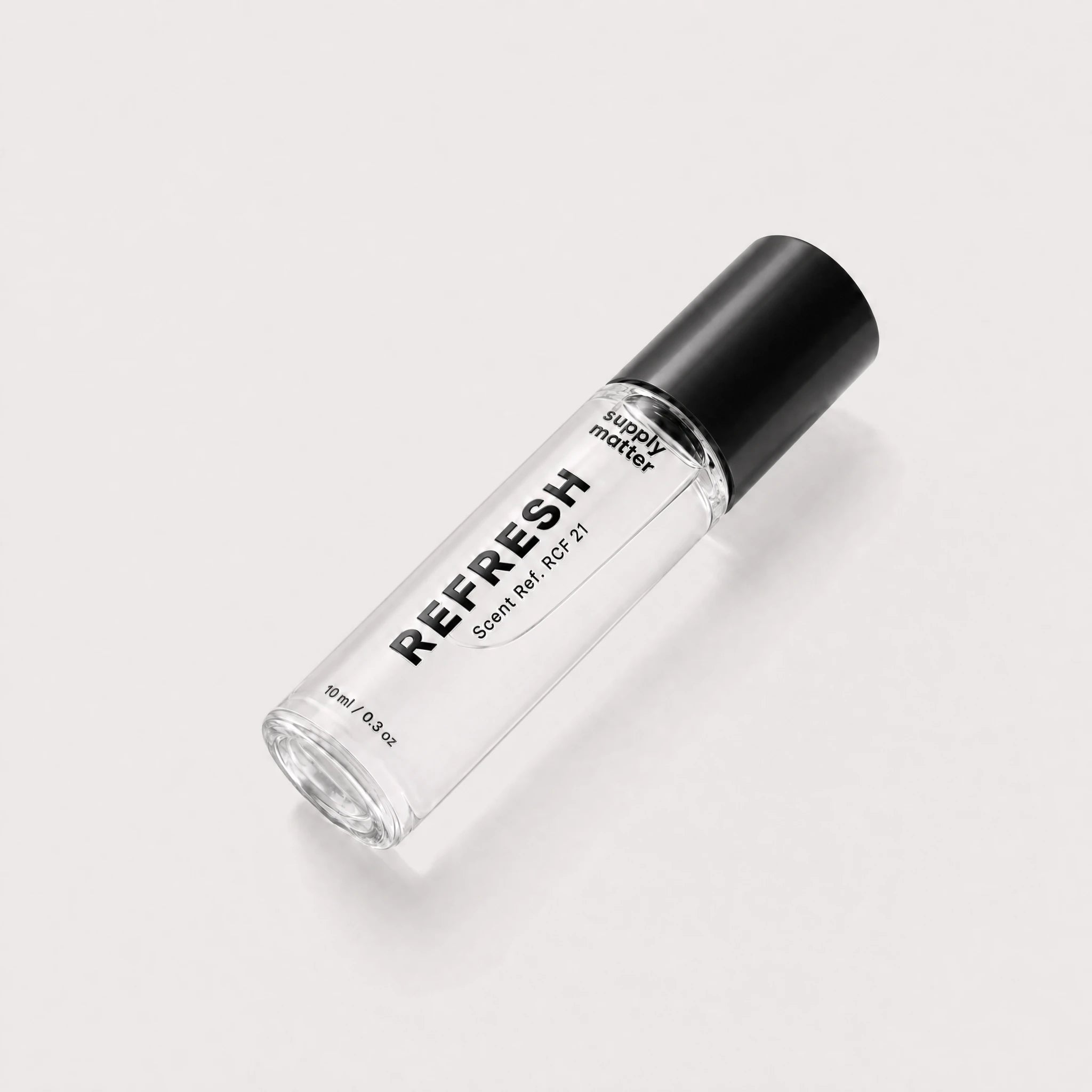 REFRESH liquid cologne bottle, angled side view