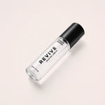REVIVE liquid cologne bottle, angled side view
